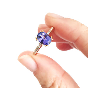 Sophisticated Oval Tanzanite with Diamond Band Rose Gold Ring