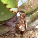 Split Rose Gold Oval Cut Morganite Pendant with Diamond Strip Highlight