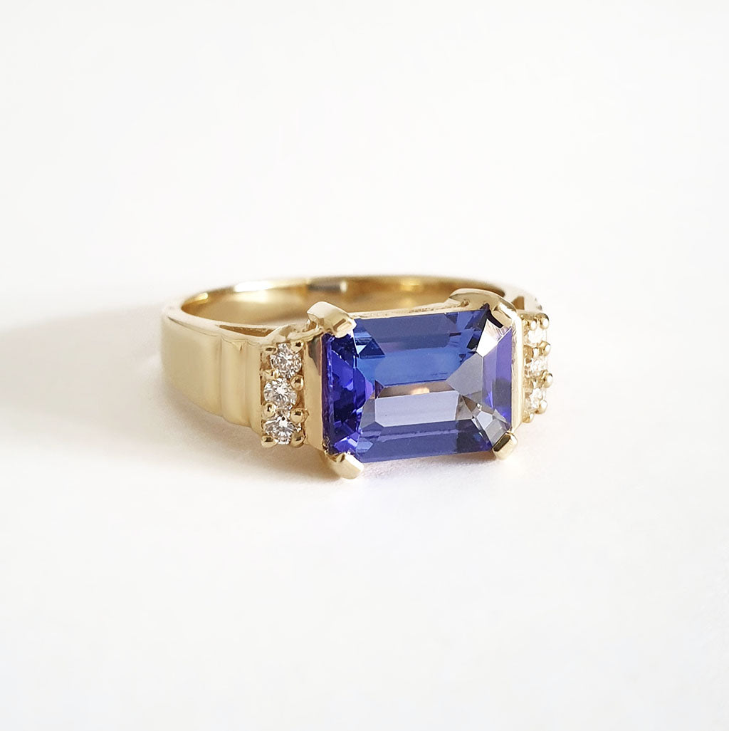 Stepped Shoulder Emerald Cut Tanzanite and Diamond Yellow Gold Ring