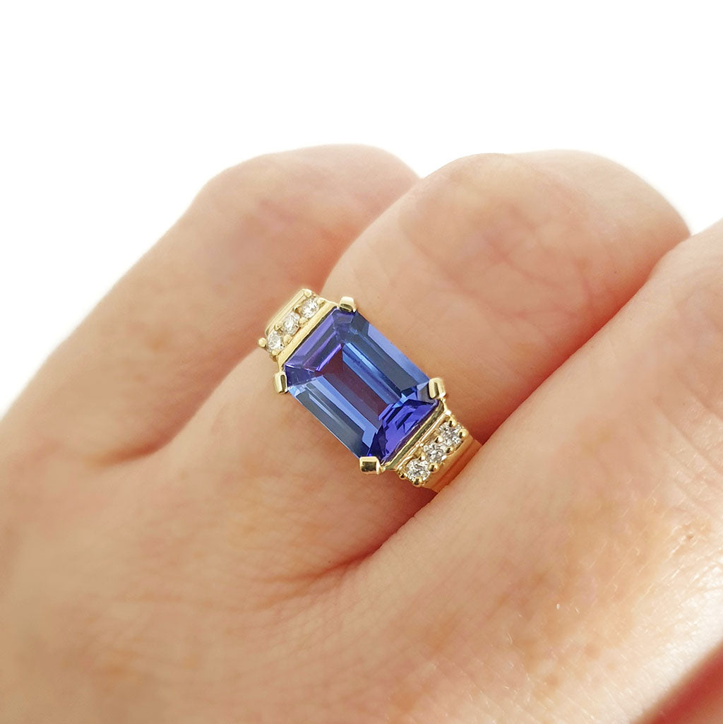 Stepped Shoulder Emerald Cut Tanzanite and Diamond Yellow Gold Ring