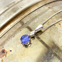 Stunning Six Claw Round Tanzanite and Quadrant Diamond Pendant