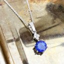 Stunning Six Claw Round Tanzanite and Quadrant Diamond Pendant