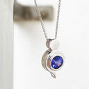 Tanzanite Pendant With White Gold Bead and Curve Detail