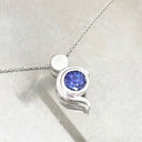Tanzanite Pendant With White Gold Bead and Curve Detail