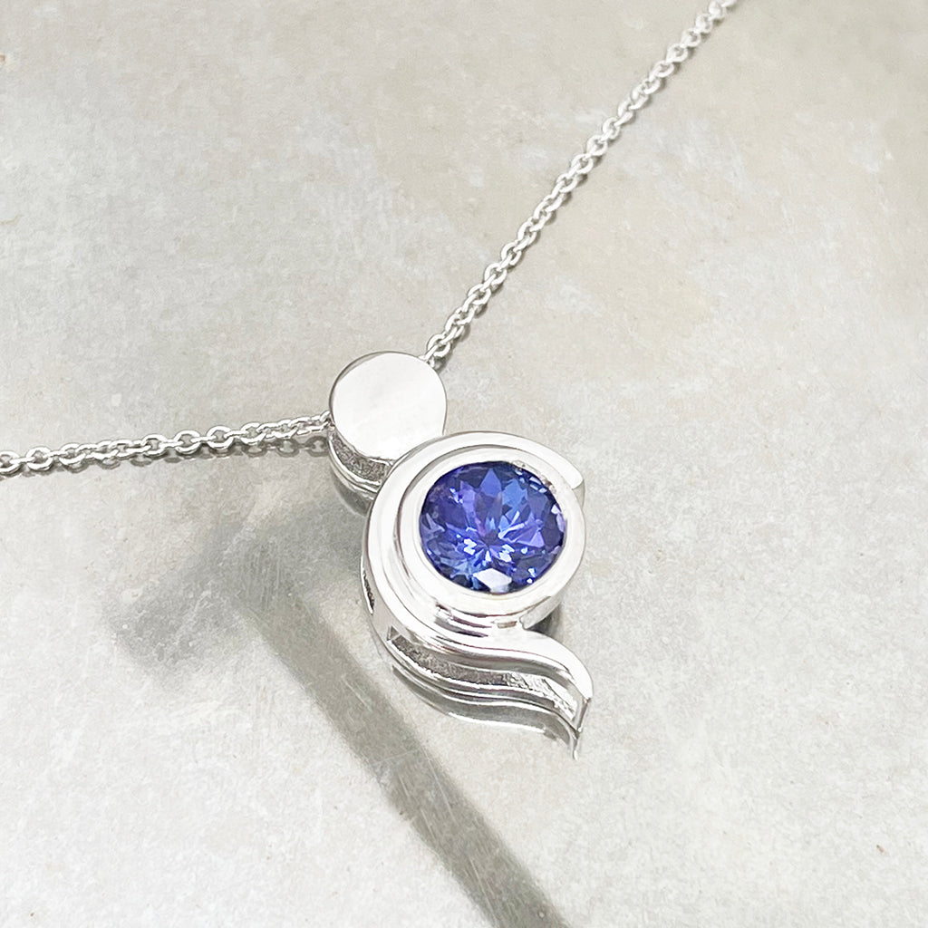 Tanzanite Pendant With White Gold Bead and Curve Detail