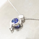 Tanzanite Pendant With White Gold Bead and Curve Detail