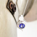 Tanzanite Pendant With White Gold Bead and Curve Detail