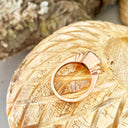 Three Stepped Shoulder Round Bezel Set Rose Gold Peridot Ring