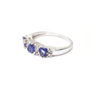 Three Trilliant Cut Tanzanite with diamond accent ring
