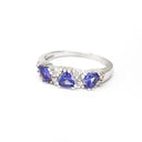 Three Trilliant Cut Tanzanite with diamond accent ring