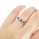 Three Trilliant Cut Tanzanite with diamond accent ring