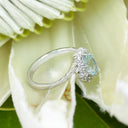 Timeless With A Twist Oval Aquamarine with Diamond Halo Ring