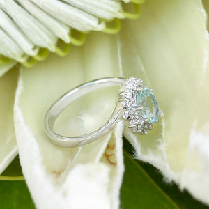 Timeless With A Twist Oval Aquamarine with Diamond Halo Ring