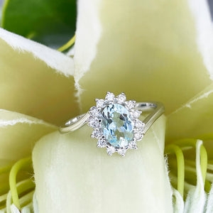 Timeless With A Twist Oval Aquamarine with Diamond Halo Ring