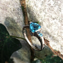 Trilliant Cut Blue Topaz With Blue Topaz Accent Ring