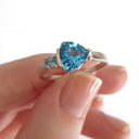 Trilliant Cut Blue Topaz With Blue Topaz Accent Ring