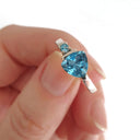 Trilliant Cut Blue Topaz With Blue Topaz Accent Ring