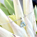 Trilliant Double Claw Aquamarine Pendant
