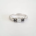 Trilogy Center White Diamond Ring with Black Diamond Accents