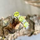 Trilogy Peridot Ring with Double Diamond Highlights