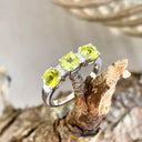 Trilogy Peridot Ring with Double Diamond Highlights