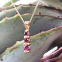 Trilogy Round Cut Rhodalite Bar Set Drop Pendant