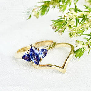 Trilogy Tanzanite Engagement Ring and V Shaped Wedding Band