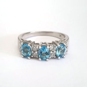Triple Oval Cut Blue Topaz With Double Diamond Accents