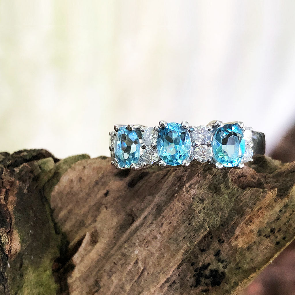 Triple Oval Cut Blue Topaz With Double Diamond Accents