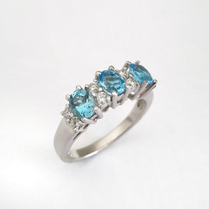 Triple Oval Cut Blue Topaz With Double Diamond Accents