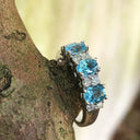 Triple Oval Cut Blue Topaz With Double Diamond Accents