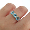 Triple Oval Cut Blue Topaz With Double Diamond Accents