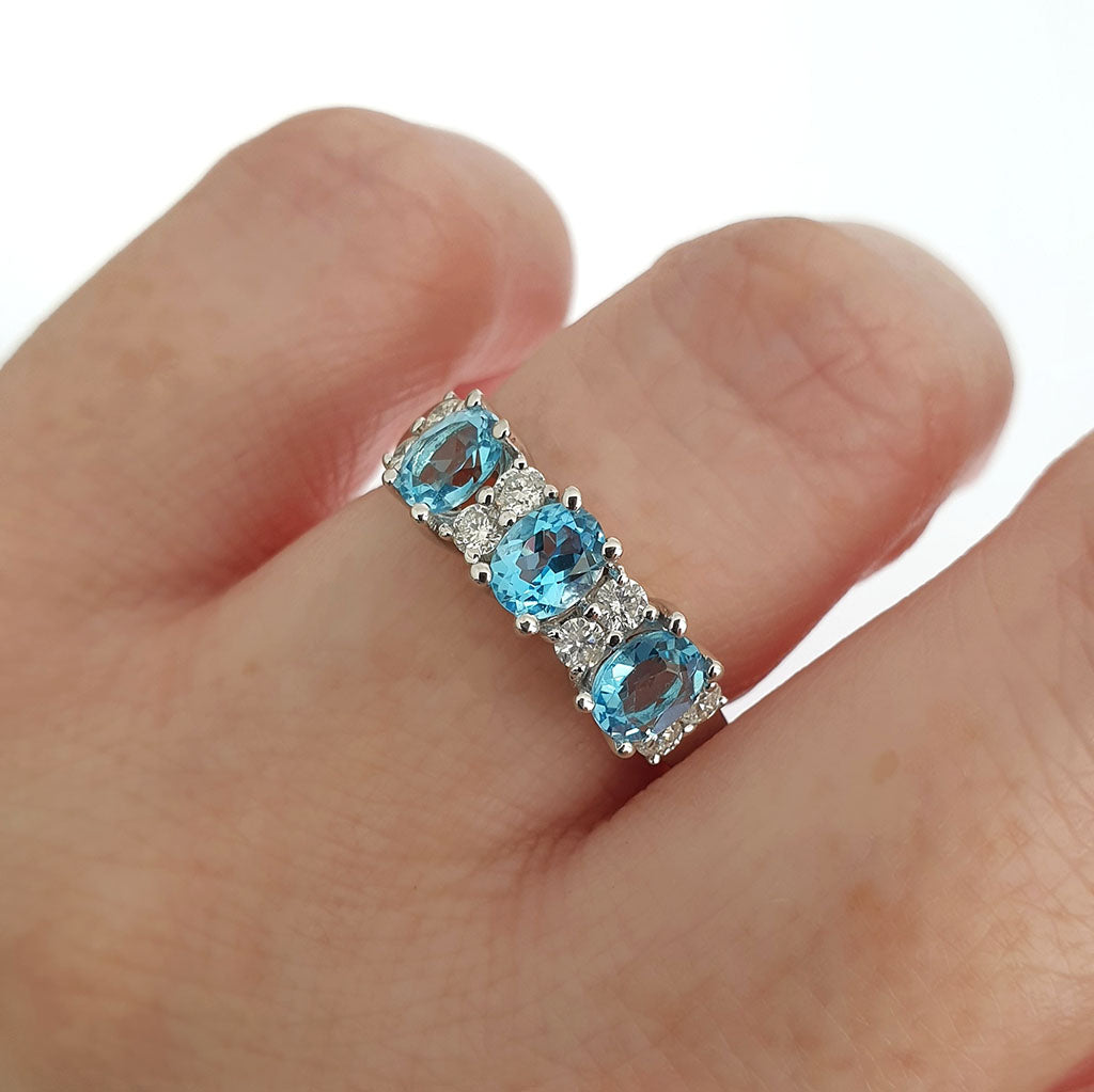 Triple Oval Cut Blue Topaz With Double Diamond Accents