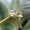 Triple Tanzanite Split Shank Yellow Gold