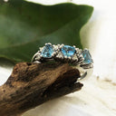 Triple Trilliant Cut Blue Topaz With Double Diamond Accents