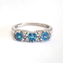 Triple Trilliant Cut Blue Topaz With Double Diamond Accents