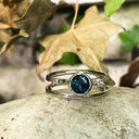 Tube Set Solitaire London Blue Topaz Set in a White Gold Split Shank Ring