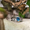 Tube Set Solitaire London Blue Topaz Set in a White Gold Split Shank Ring
