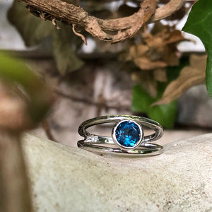 Tube Set Solitaire London Blue Topaz Set in a White Gold Split Shank Ring