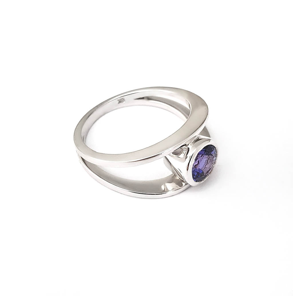 Tube Set Solitaire Tanzanite Set in a White Gold Split Shank Ring