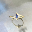 Unique Marquise Cut Tanzanite and Diamond Swish Yellow Gold Ring