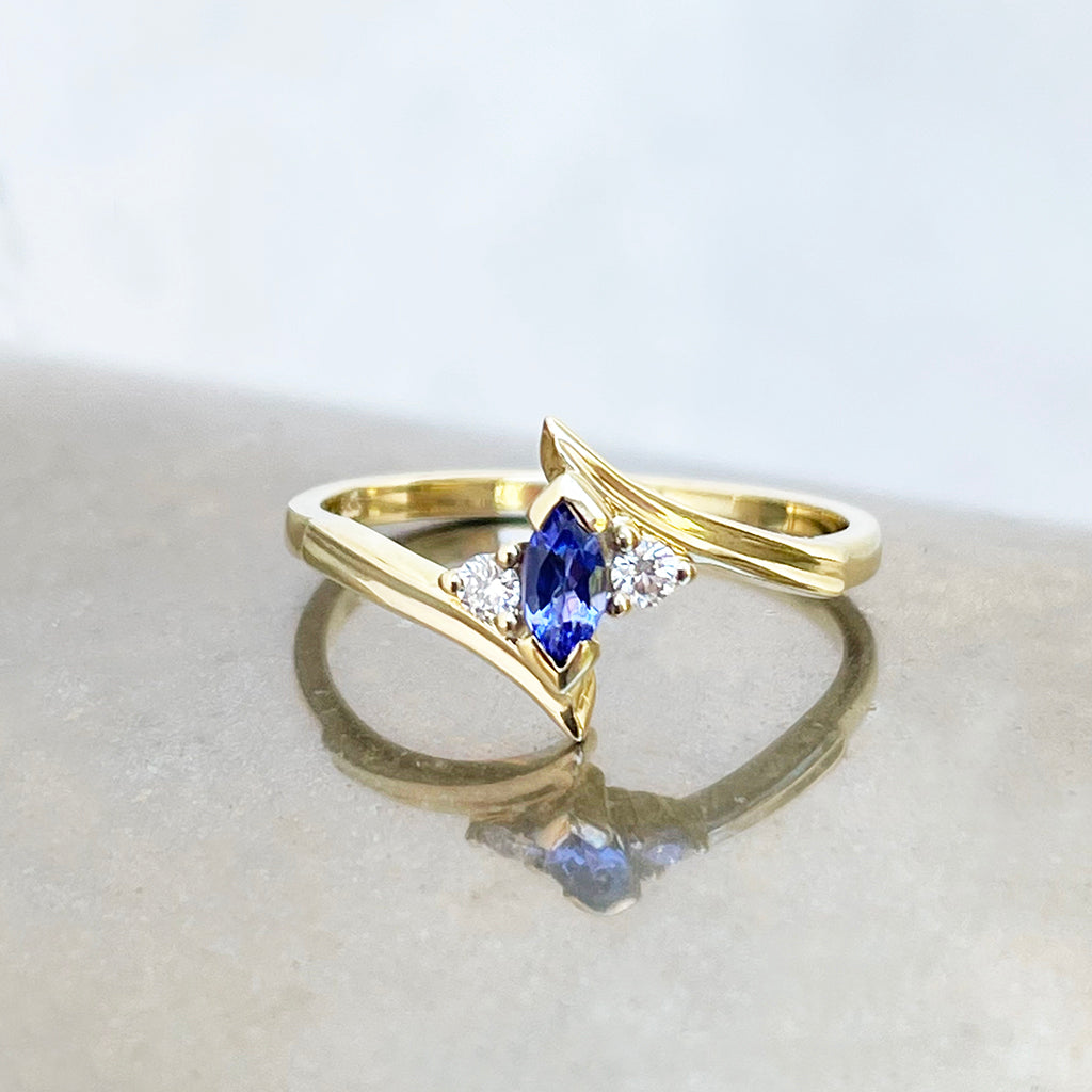 Unique Marquise Cut Tanzanite and Diamond Swish Yellow Gold Ring