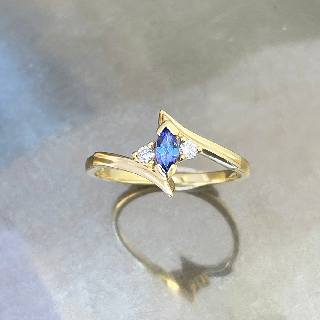 Unique Marquise Cut Tanzanite and Diamond Swish Yellow Gold Ring