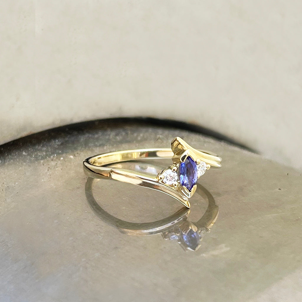 Unique Marquise Cut Tanzanite and Diamond Swish Yellow Gold Ring