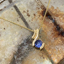 Unique Multiple Swish Tanzanite Yellow Gold Pendant