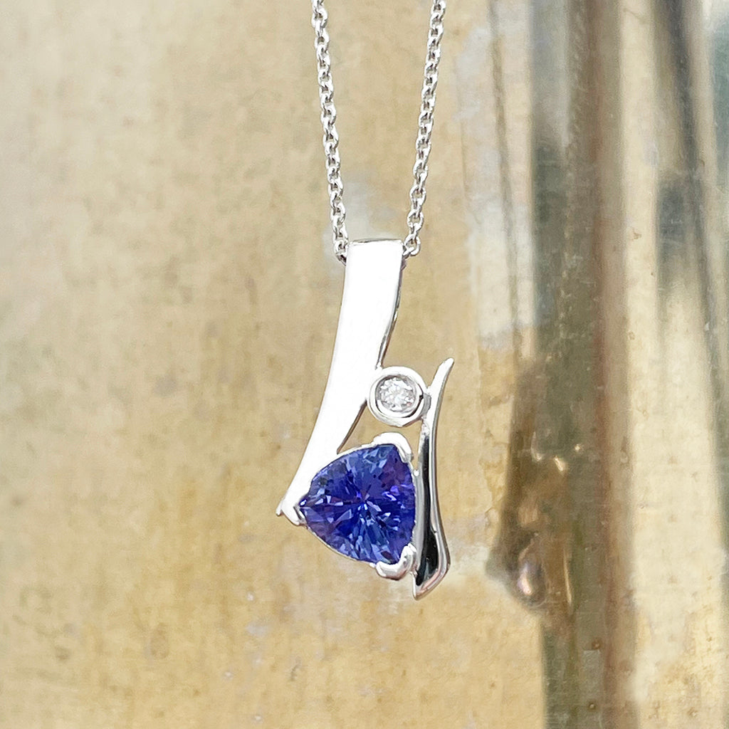 Unique Trilliant Tanzanite and Round Bezel Set Diamond Pendant