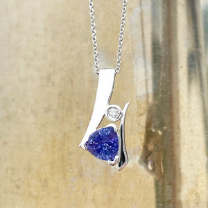 Unique Trilliant Tanzanite and Round Bezel Set Diamond Pendant