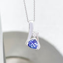 Unique Trilliant Tanzanite and Round Bezel Set Diamond Pendant
