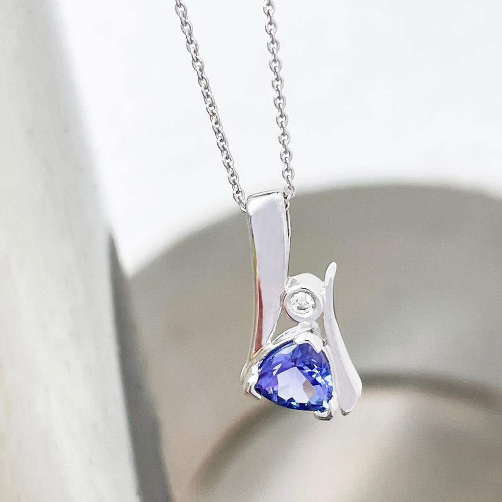 Unique Trilliant Tanzanite and Round Bezel Set Diamond Pendant