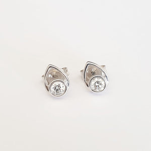White Round Cut Diamonds in a White Gold Pear Shaped Stud